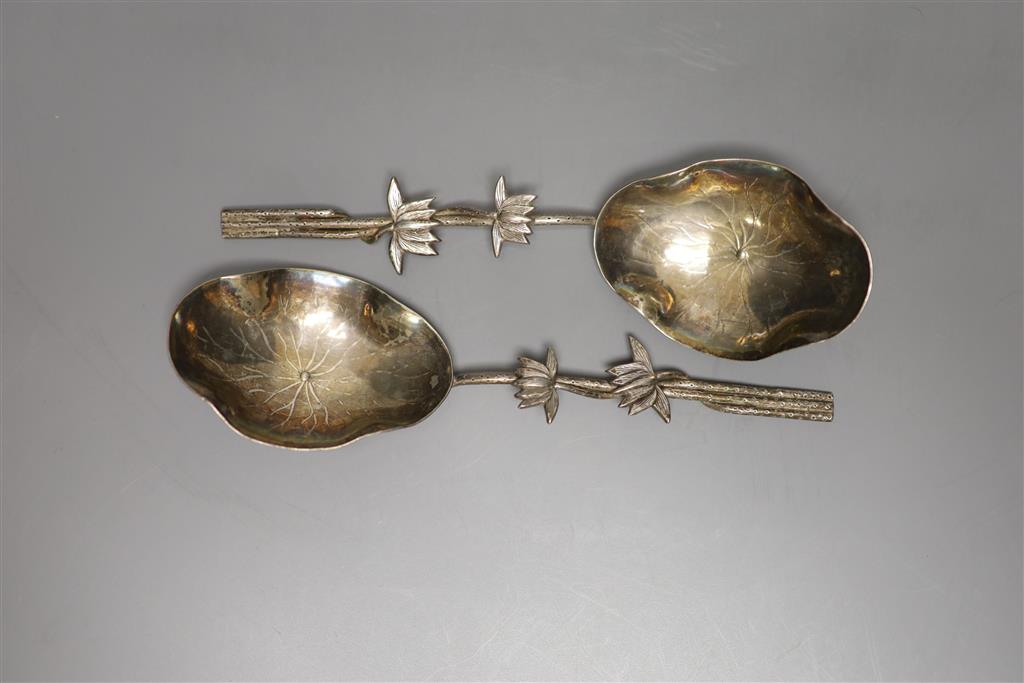 A pair of early 20th century Chinese white metal spoons, with foliate stems, by Wang Hing, 19.3cm, 3 oz.